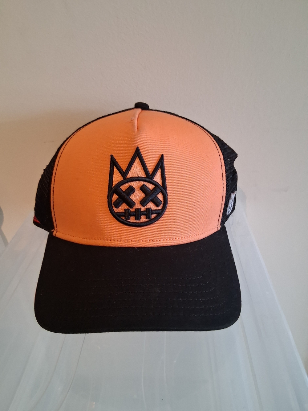 Cult of Individuality Orange and Black Trucker Hat with Crown Skull Logo!